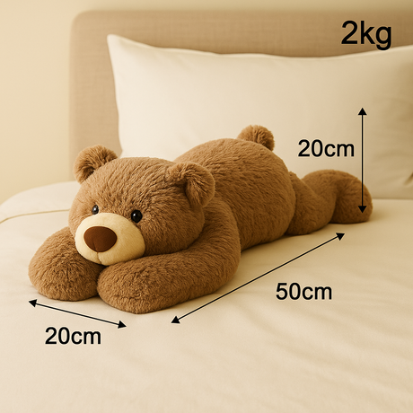 Verzwaringsknuffel 2 kg in de vorm van een beer met afmetingen op een bed